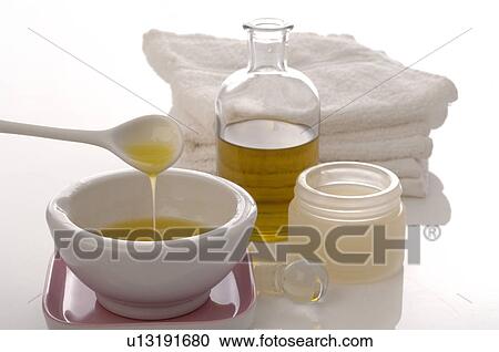 Stock Image - Massage oil with cocoa butter. Fotosearch