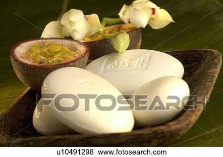 Stock Photo - Soap dish with orchids and passion fruit. Fotosearch