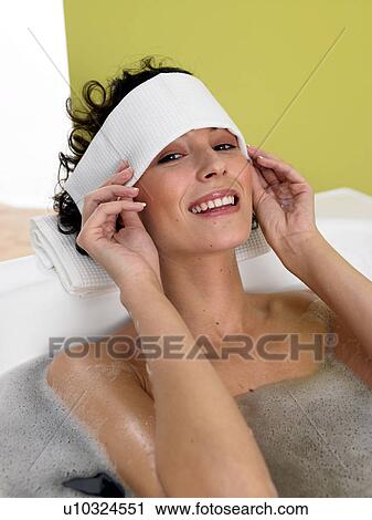 Woman relaxing in bathtub View Large Photo Image Stock Image - Woman relaxing in bathtub. Fotosearch