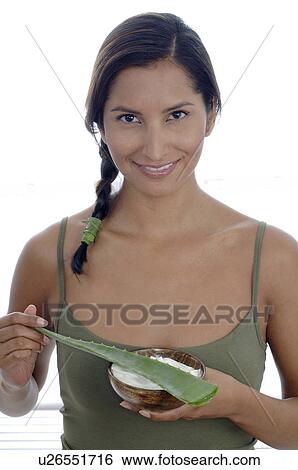 Stock Photograph - Woman with Aloe mask. Fotosearch
