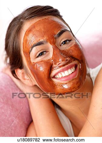 Young woman with chocolate mask View Large Photo Image Stock Image - Young woman with chocolate mask. Fotosearch