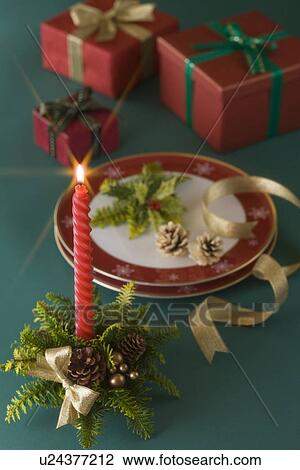 Stock Image - Christmas Candle and Plate. Fotosearch