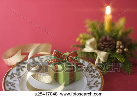 Stock Photo - Christmas Plate and Candle. Fotosearch