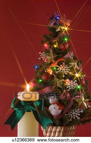 Stock Photo - Christmas Tree and Candle. Fotosearch