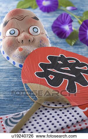 Stock Photograph - Mask of Hyottoko and Fan. Fotosearch
