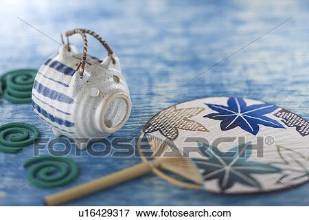 Stock Photo - Mosquito Coil and Pig-shaped Container. Fotosearch