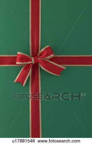 Stock Photograph - Red Ribbon on Green Background. Fotosearch
