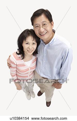 Couple, Couple bonding together and looking up with smile View Large Photo Image Picture - Couple, Couple bonding together and looking up with smile. Fotosearch