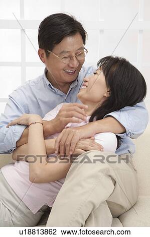 Stock Image - Couple, Couple bonding together and looking at each other with smile. Fotosearch