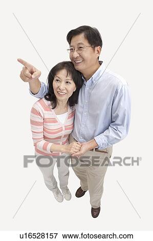 Couple, Couple bonding together and looking up with smile View Large Photo Image Stock Photo - Couple, Couple bonding together and looking up with smile. Fotosearch