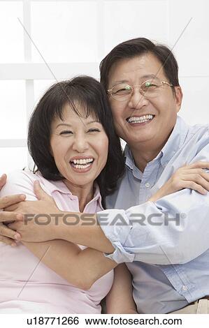 Couple, Couple bonding together and laughing View Large Photo Image Stock Photograph - Couple, Couple bonding together and laughing. Fotosearch