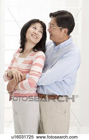 Stock Photography - Couple, Couple bonding together and looking at each other with smile. Fotosearch