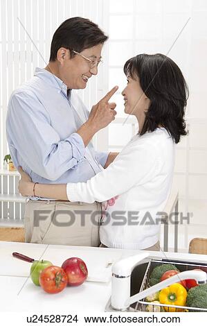 Couple, Couple embracing and smiling at each other View Large Photo Image Picture - Couple, Couple embracing and smiling at each other. Fotosearch