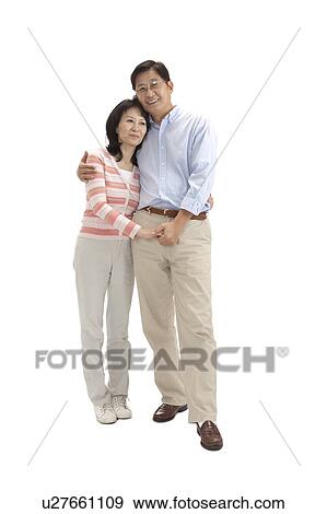 Stock Photo - Couple, Couple holding hands and bonding together with smile. Fotosearch