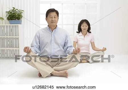 Couple, Couple making lotus position with eyes closed together View Large Photo Image Stock Photography - Couple, Couple making lotus position with eyes closed together. Fotosearch