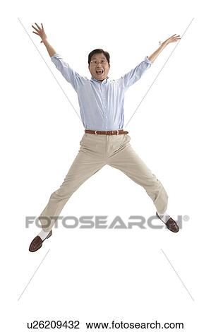 Husband, Man jumping with hands outstretched and laughing View Large Photo Image Stock Image - Husband, Man jumping with hands outstretched and laughing. Fotosearch