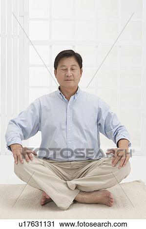 Husband, Man making lotus position with eyes closed View Large Photo Image Stock Image - Husband, Man making lotus position with eyes closed. Fotosearch