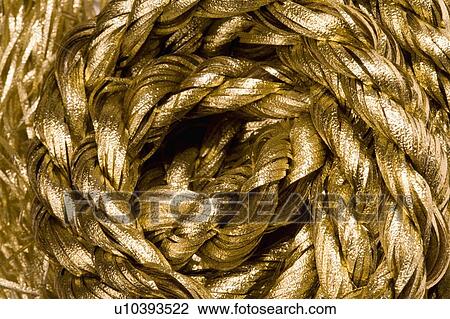 Stock Image - Rope in golden color. Fotosearch