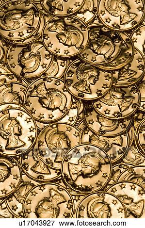 Stock Photo - Toy Gold Coins scattered. Fotosearch