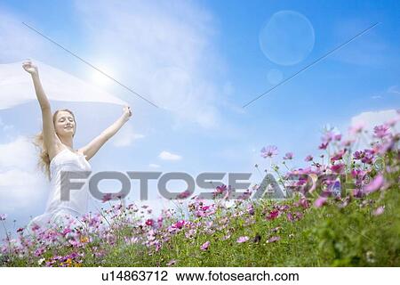 Lohas, Environmental Conservation, Digitally generated image of woman standing in the flower field View Large Photo Image Stock Image - Lohas, Environmental Conservation, Digitally generated image of woman standing in the flower field. Fotosearch