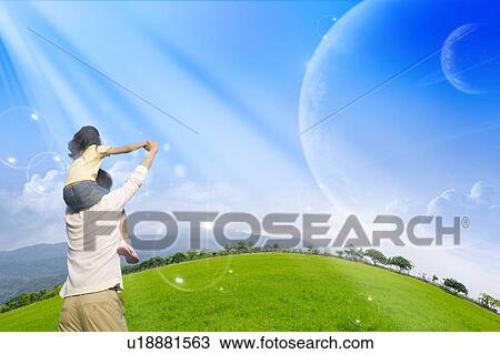 Stock Image - Lohas, Environmental Conservation, Digitally generated image of a father carrying his girl standing on the grass in the sunshine. Fotosearch