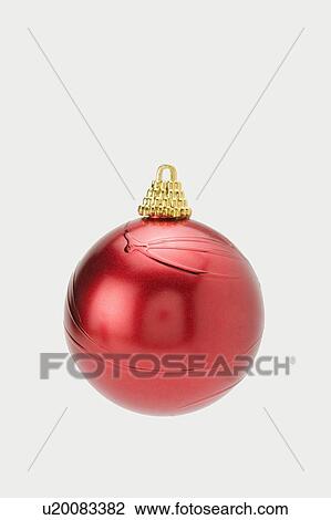 Stock Image - A red Christmas Bauble. Fotosearch