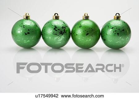 A row of green Christmas baubles View Large Photo Image Stock Image - A row of green Christmas baubles. Fotosearch