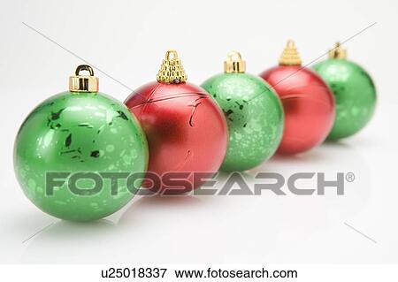 Christmas baubles in a row View Large Photo Image Stock Photo - Christmas baubles in a row. Fotosearch