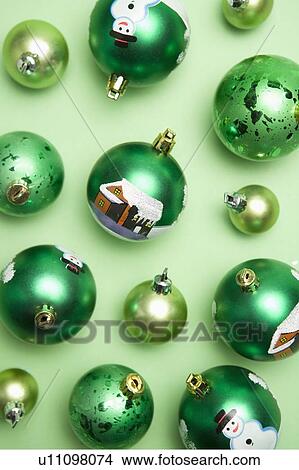 Picture - Green Christmas baubles. Fotosearch