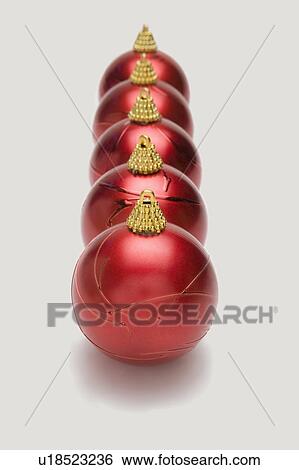 Red Christmas baubles in a row View Large Photo Image Stock Photograph - Red Christmas baubles in a row. Fotosearch