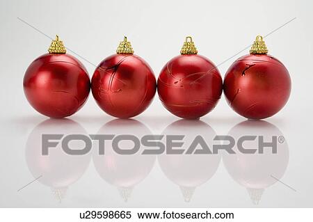 Red Christmas baubles on a table View Large Photo Image Stock Photography - Red Christmas baubles on a table. Fotosearch