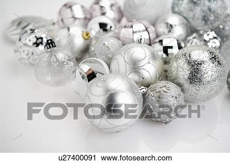 Stock Image - Silver Christmas baubles. Fotosearch