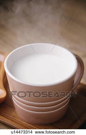 A cup of hot milk View Large Photo Image Picture - A cup of hot milk. Fotosearch