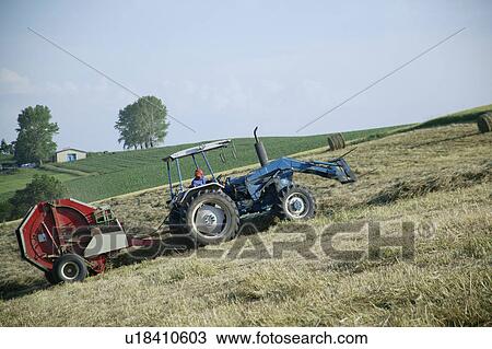 Stock Image - A farmer working in field. Fotosearch