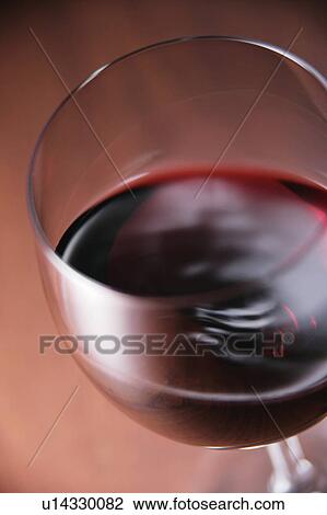A glass of red wine View Large Photo Image Stock Image - A glass of red wine. Fotosearch