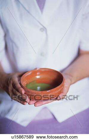 A mature woman holding a tea cup View Large Photo Image Stock Photo - A mature woman holding a tea cup. Fotosearch