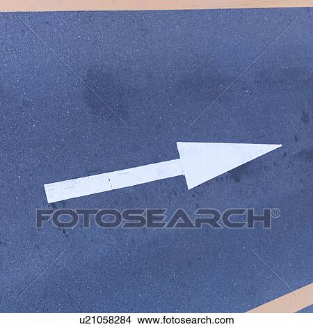 Picture - Arrow sign on road. Fotosearch