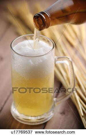 Beer pouring into beer glass View Large Photo Image Stock Photo - Beer pouring into beer glass. Fotosearch