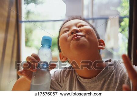 Stock Photo - Boy making a face. Fotosearch
