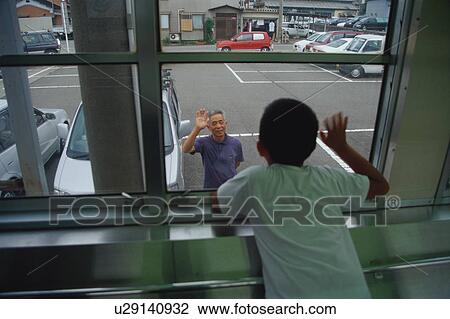 Boy on train waving goodbye to his grandfather View Large Photo Image Stock Image - Boy on train waving goodbye to his grandfather. Fotosearch