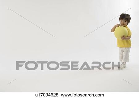 Boy playing with ball View Large Photo Image Stock Photo - Boy playing with ball. Fotosearch