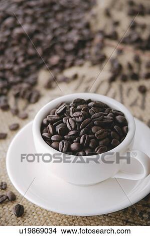 Picture - Coffee beans in cup. Fotosearch