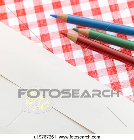 Stock Image - Colored pencils and envelope. Fotosearch