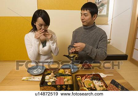 Stock Photo - Couple drinking sake. Fotosearch