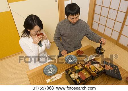 Couple drinking sake View Large Photo Image Stock Photo - Couple drinking sake. Fotosearch