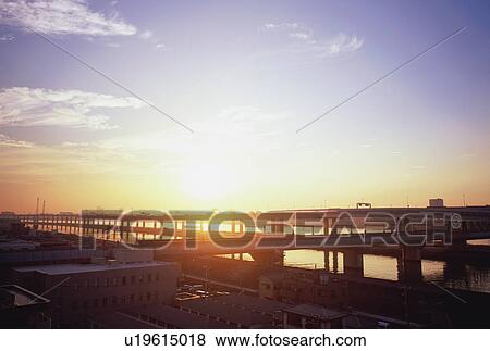 Stock Photo - Elevated road over river, Tokyo, Japan, Sunset. Fotosearch