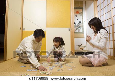 Family playing card game View Large Photo Image Stock Photo - Family playing card game. Fotosearch