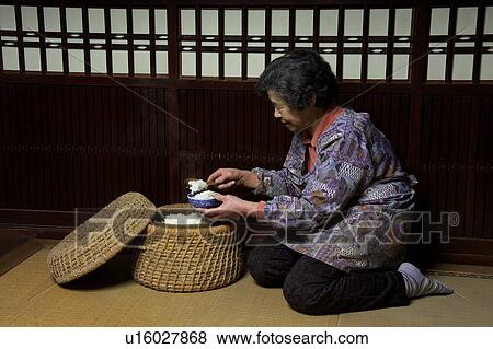 Farmer serving rice View Large Photo Image Stock Photo - Farmer serving rice. Fotosearch