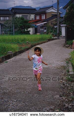 Girl running with pinwheel View Large Photo Image Stock Image - Girl running with pinwheel. Fotosearch