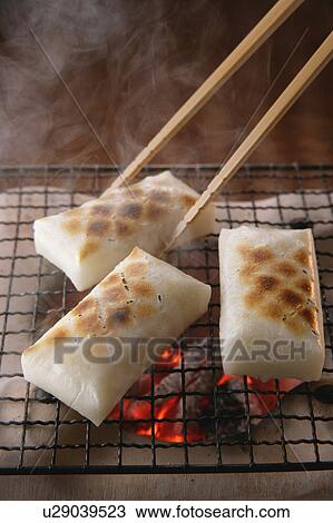 Grilled rice cakes over charcoal fire View Large Photo Image Stock Image - Grilled rice cakes over charcoal fire. Fotosearch